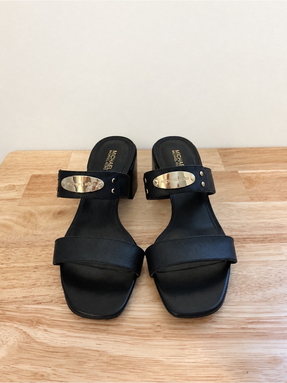 MICHAEL Michael Kors Black Slide Mules with Gold Logo Plaque